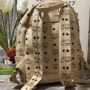 MCM | Bags | Mcm Tan Backpack With Black Logo And Silver 
